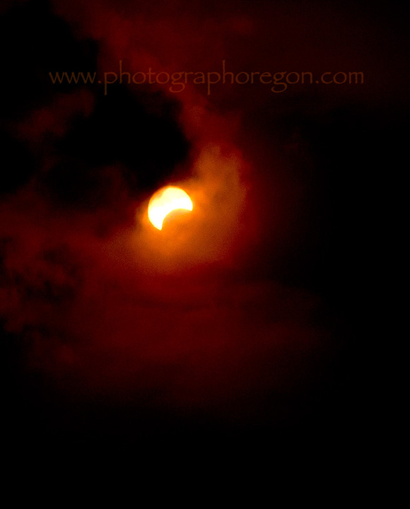 Solar eclipse with clouds